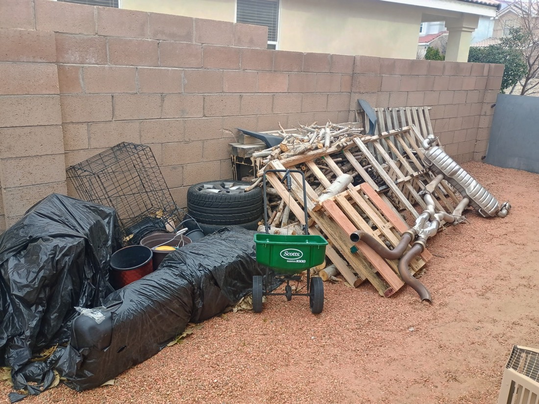 Cluttered garage before junk removal